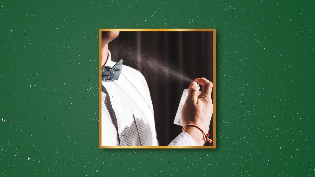 a man spraying perfume