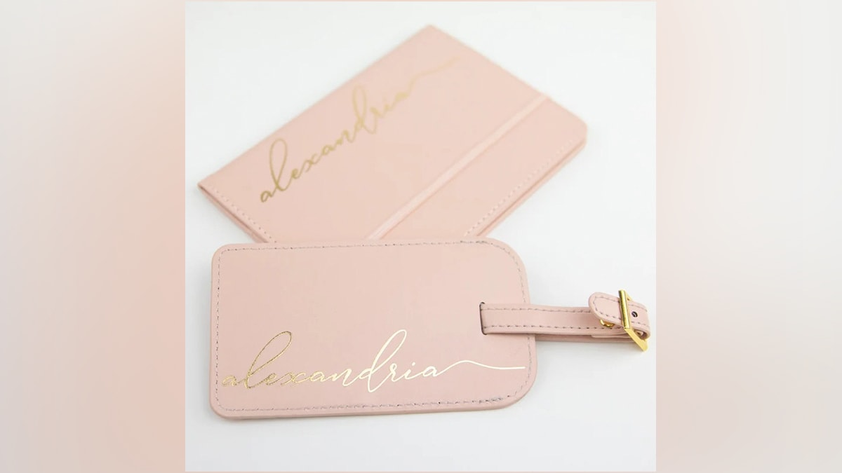 a pink colored personalised passport cover