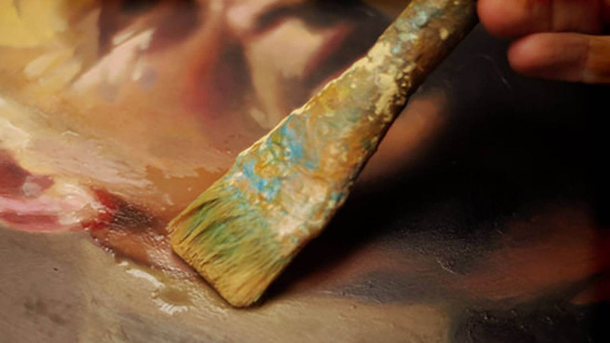 a painting being glazed shown to prevent it from getting dirty.