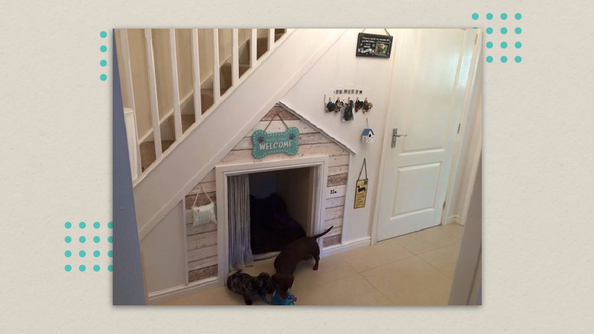 a dog bed incorporated in the nook under the stairs