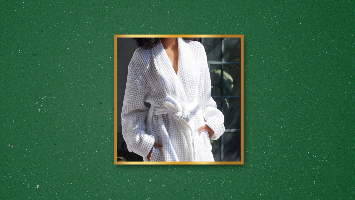 a woman in a white waffle robe 
