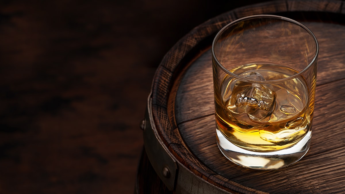 Whiskey glass on a wooden surface
