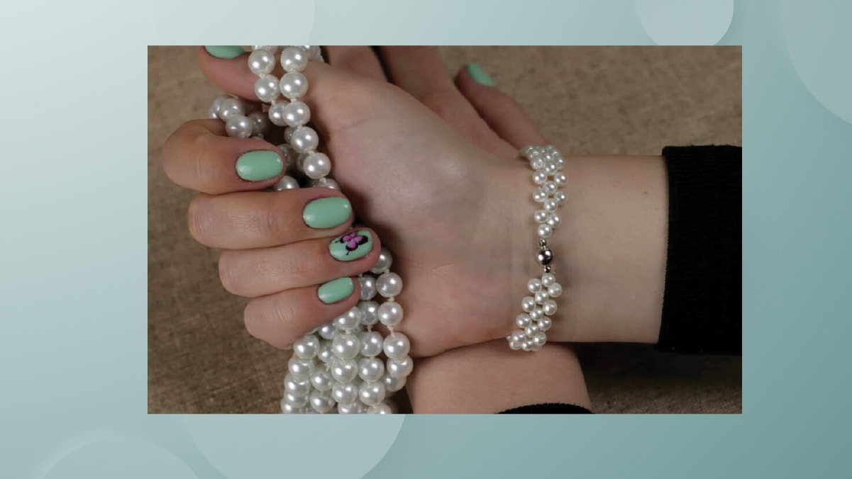 white beads bracelet on the wrists. 