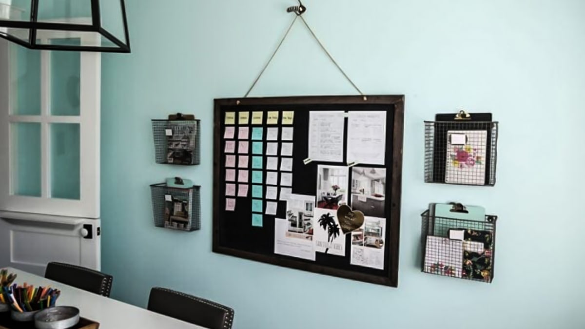 A to-do list displayed on blue wall