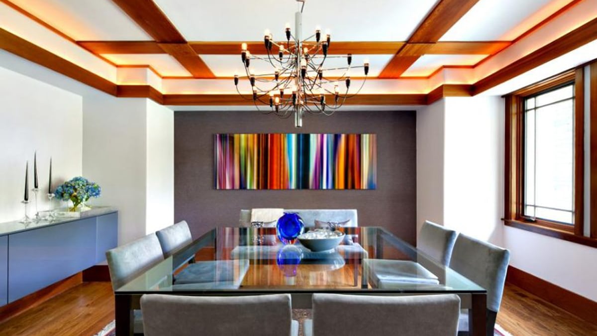 a bright wall art behind the dining table