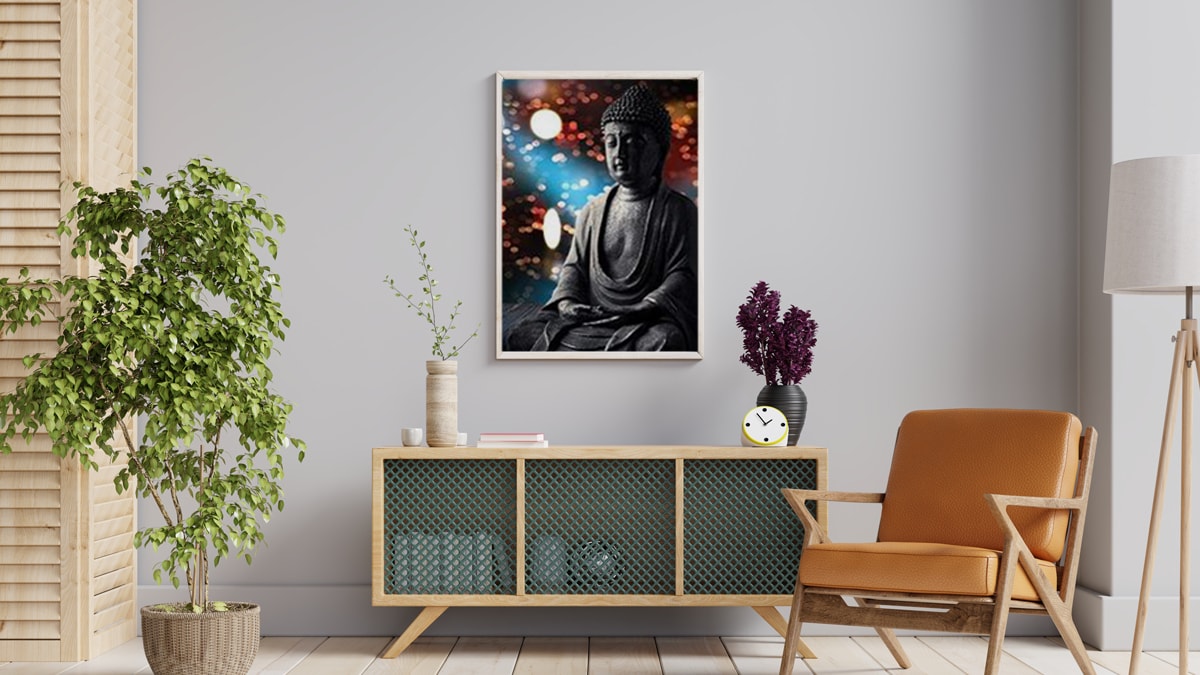 a Buddha wall art mounted on the off-white colored wall with stunning pieces of furniture