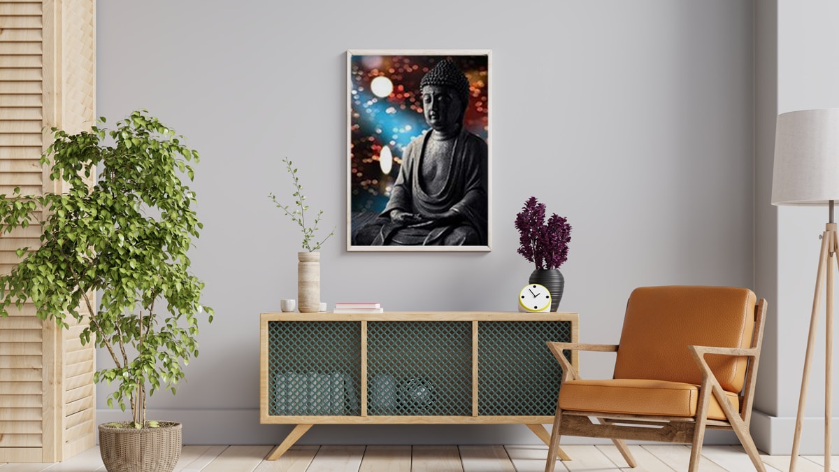 a Buddha wall art mounted on the off-white colored wall with stunning pieces of furniture