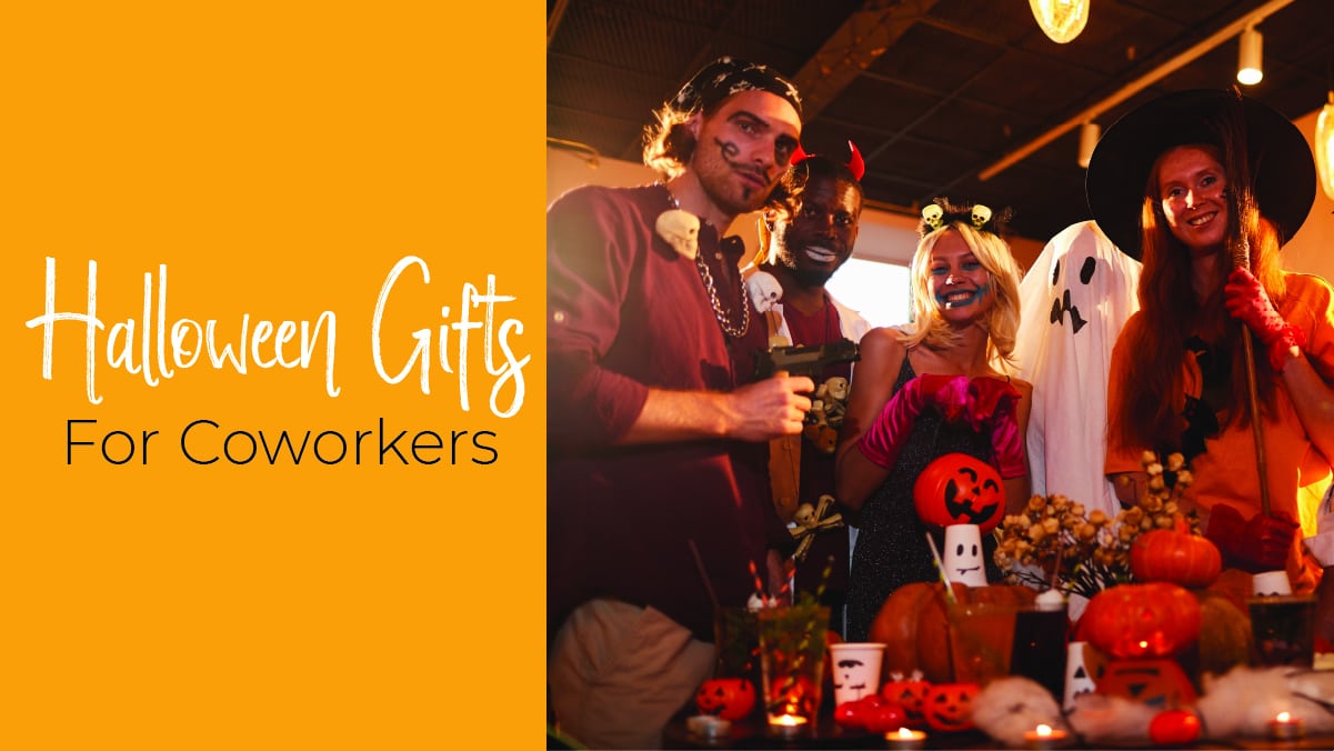 A group of men and women all dressed up in Halloween costumes. There is a table with some Halloween lamps on it. The text reads Halloween gifts for coworkers.