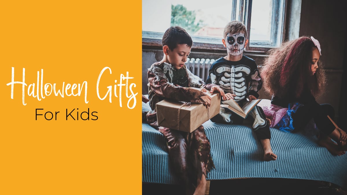 Three kids dressed in hallooween costumes opening halloween gifts. the text reads Halloween Gifts for Kids 