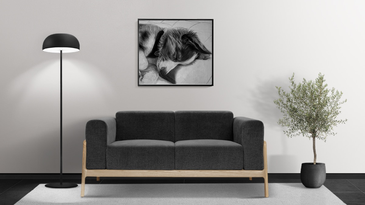 a cat portrait mounted behind the sofa.
