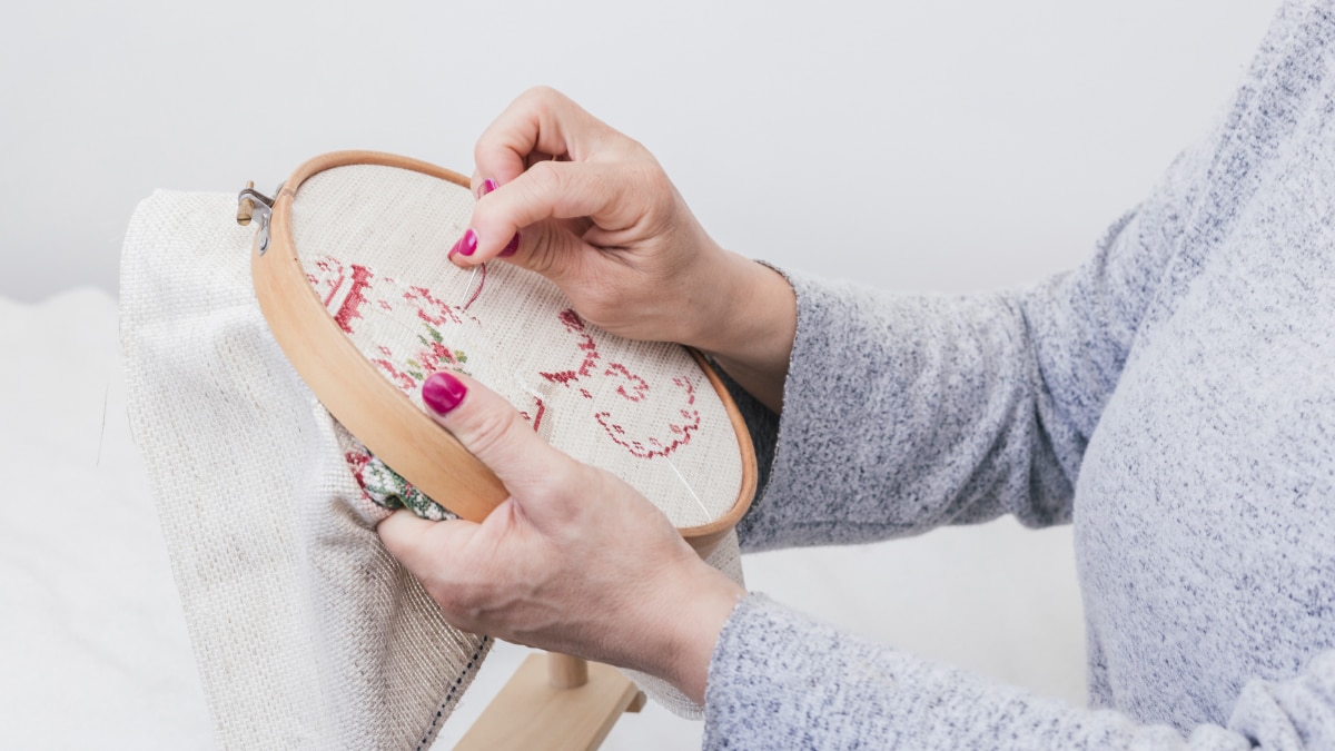 a woman doing Embroidery Hoop Art