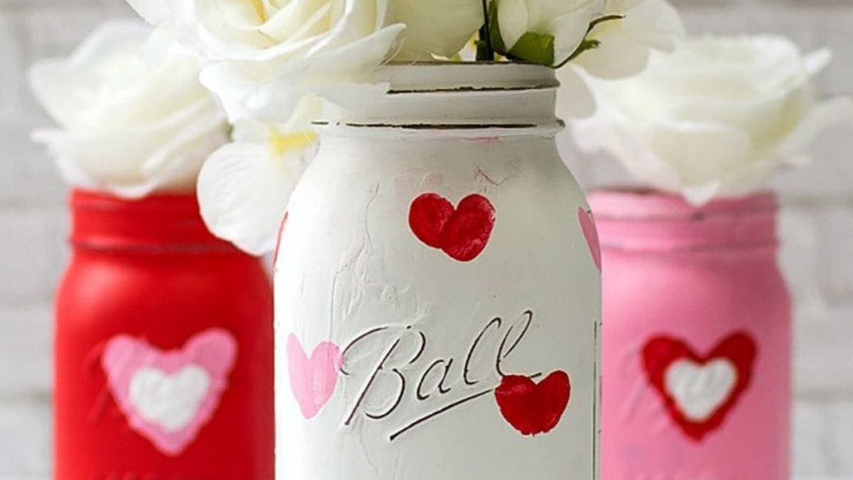Three jars in white, red and pink that is customized with heart shaped thumprints