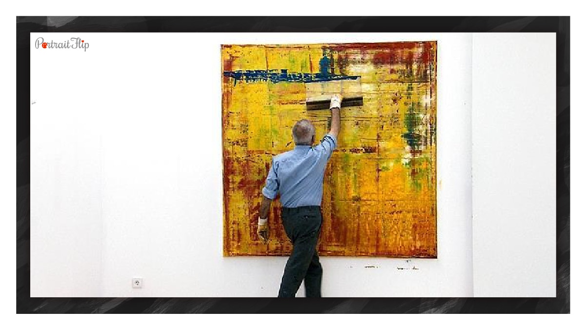 Man painting an abstract painting