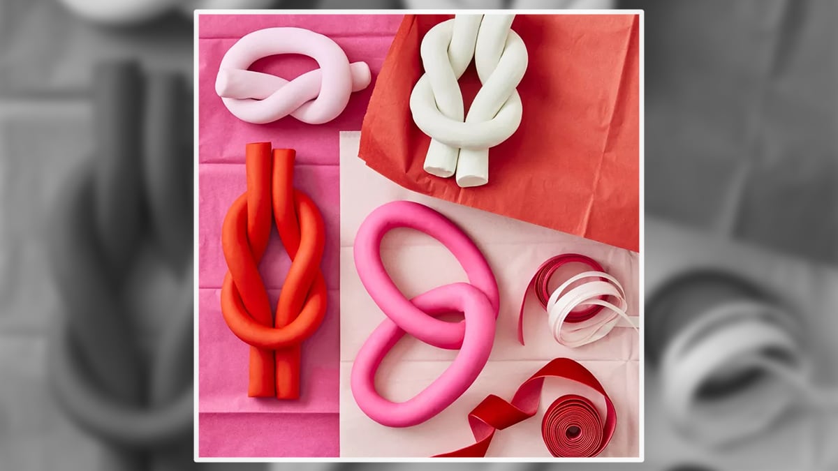 Love knots placed on colorful papers