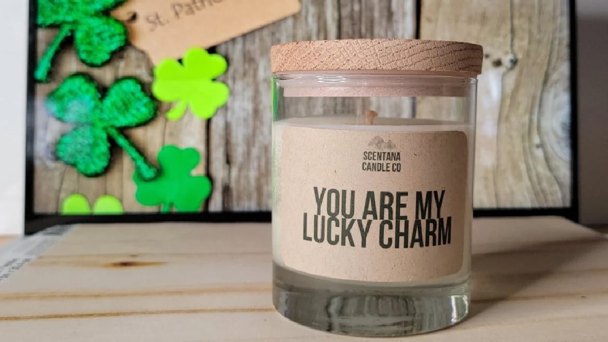 Irish candle with a label of "You are my lucky charm" placed on a wooden table