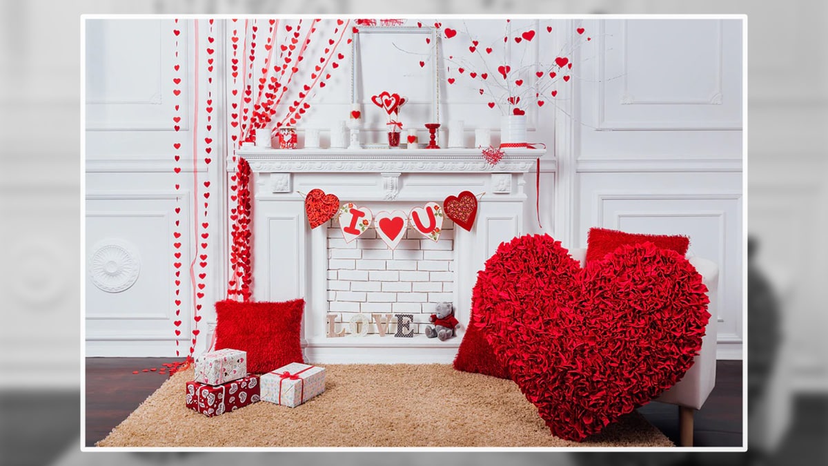 A set up of photo booth decorated with red heart shape items