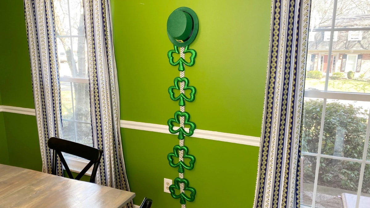 Shamrock Door Hanger on a green wall with clover leaf design