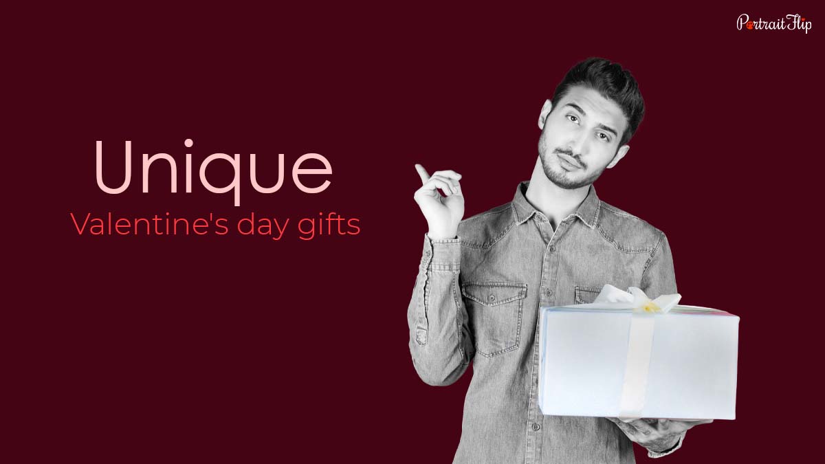 Man standing with one gift in hand and another pointing towards the text Unique Valentine's day gifts