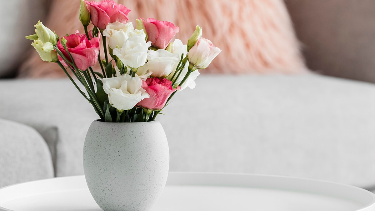 A flower vase set on the table in living room area