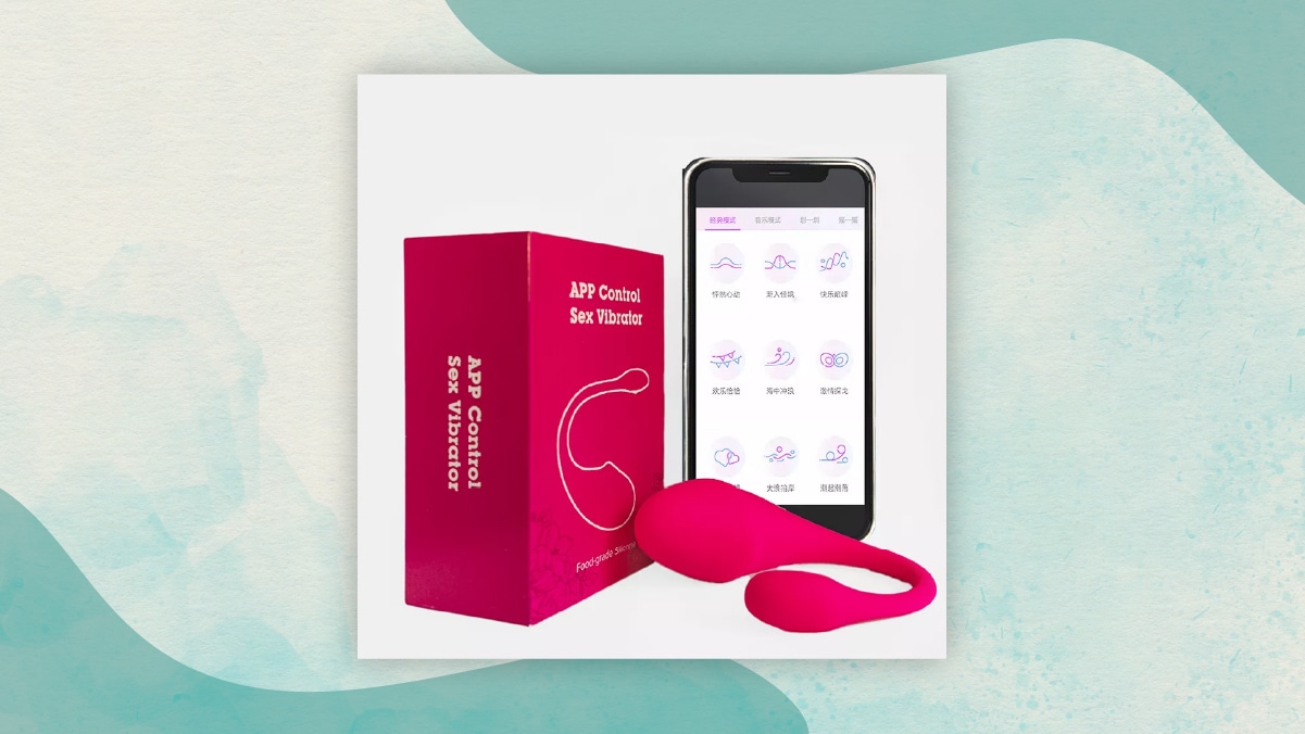 A maroon colored box with" app controlled sex vibrator written on it" alongside a mobile phone in a white background. One of the best gifts for long distance relationships. 