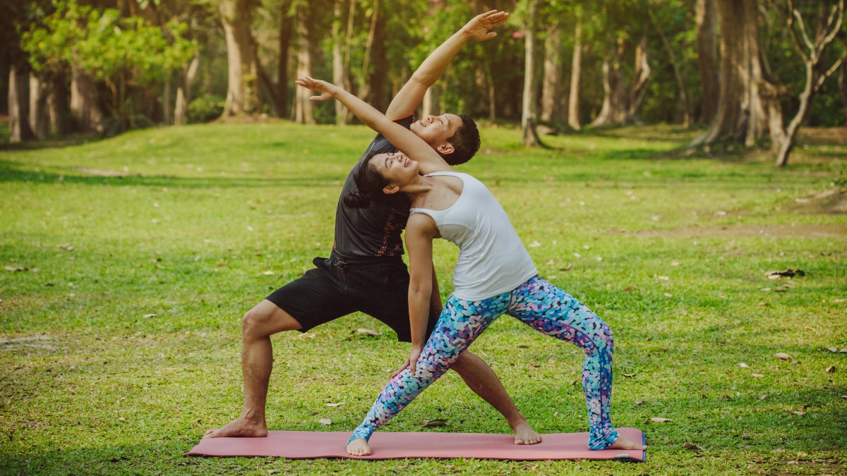 A couple doing yoga together