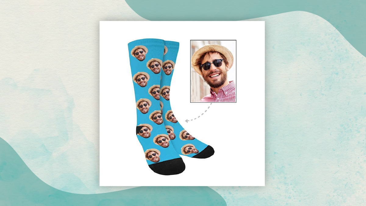 A pair of blue socks with prints of the photos present in white background.  