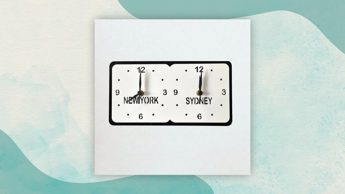 A clock showing the time zones of New York and Sydney in a white background perfect as gifts for long distance relationships. 