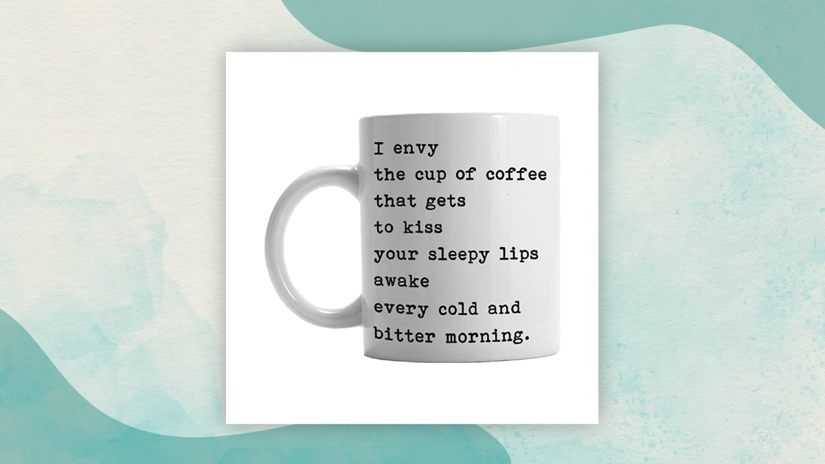 A white coffee mug with a " I envy" message on it in a white background best gifts for long distance relationships, specially for coffee lovers.
