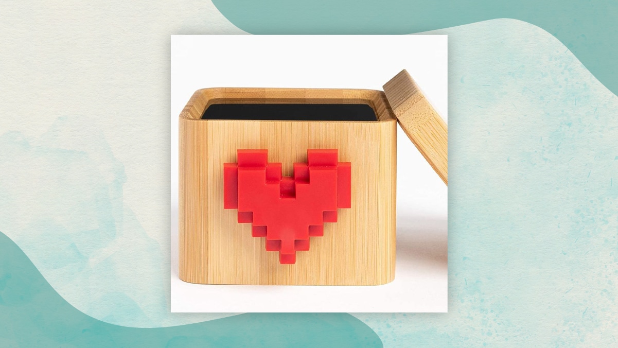 A brown open box with a red lego heart embedded on it in a white a background as perfect gifts for long distance relationships. 