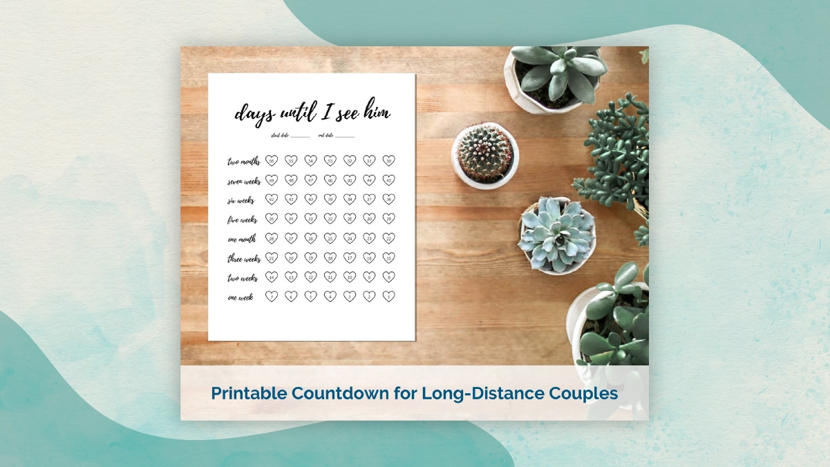 A printable countdown calendar with title " days until I see him " with all the dates kept in heart shapes kept on a brown table alongside four plants. 