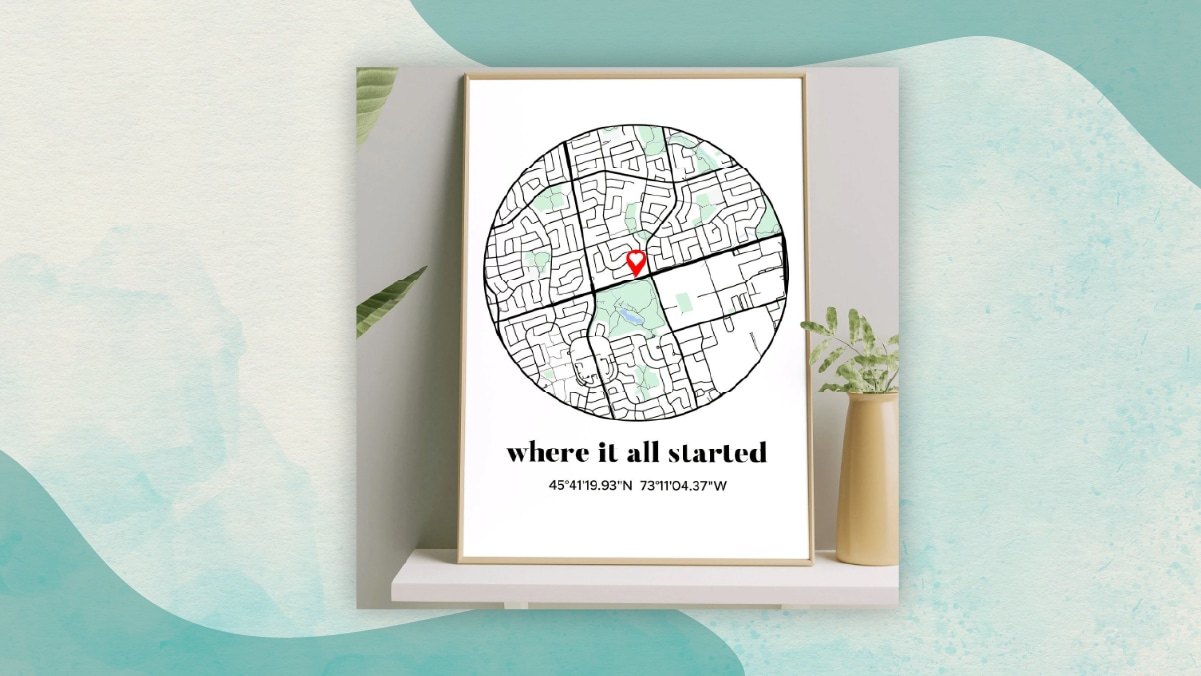 A map figure in a round shaped frame with a location pinned on it with "where it all started" written on it in a white background as one of the best gifts for long distance relationships. 