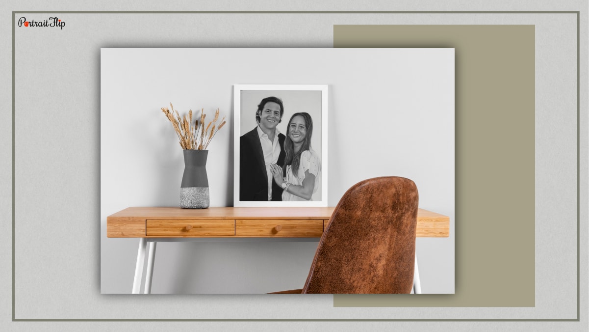 A living room mockup which features a portrait of a couple. 