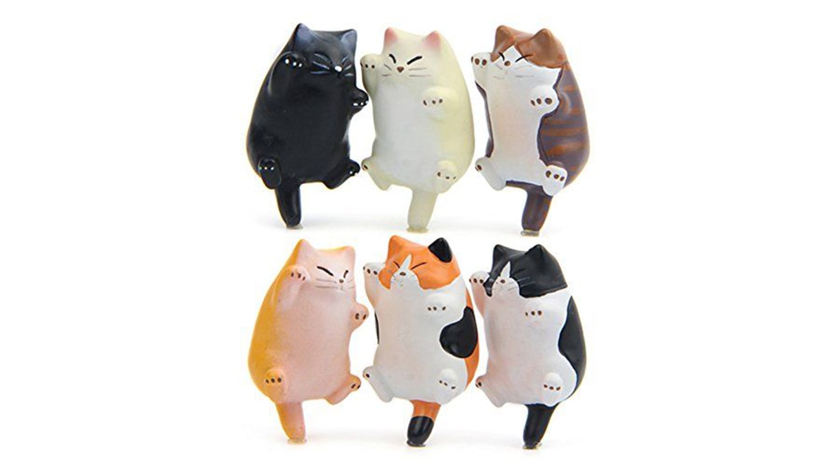6 cat shaped fridge magnets in a white background. 