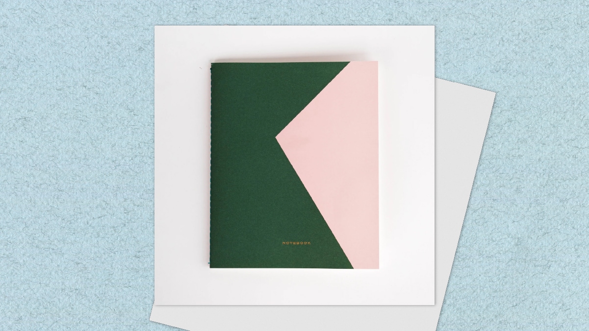 A colorblock notebook is one of the first anniversary presents 