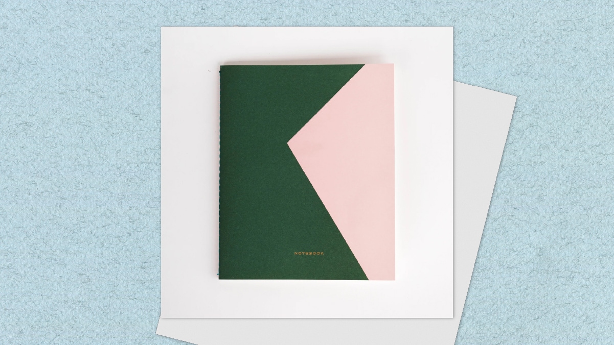 A colorblock notebook is one of the first anniversary presents