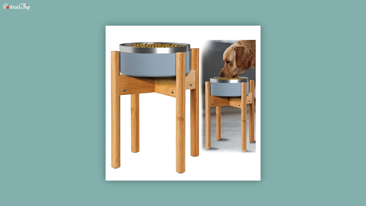 A dog food bowl with a wooden frame and a dog eating food from the bowl as dog birthday gifts. 