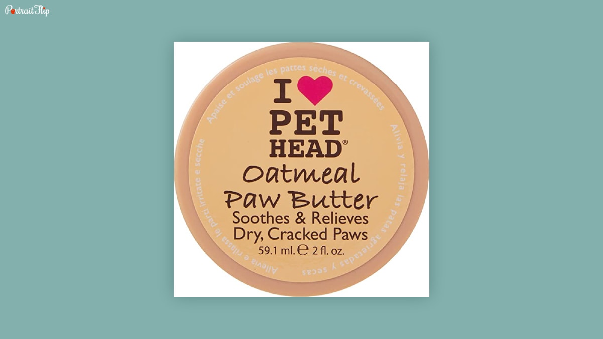 A small round shaped box of oatmeal paw butter for dogs with "I love pet head" written on it, kept in a white background as dog birthday gifts. 