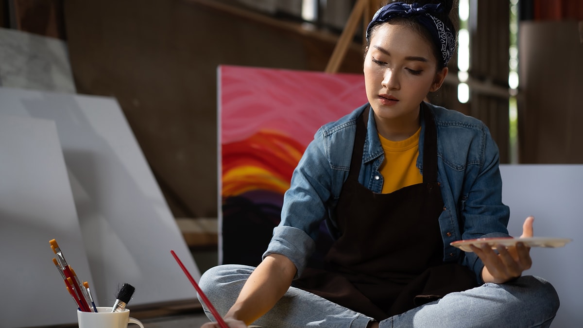 A girl is creating a painting