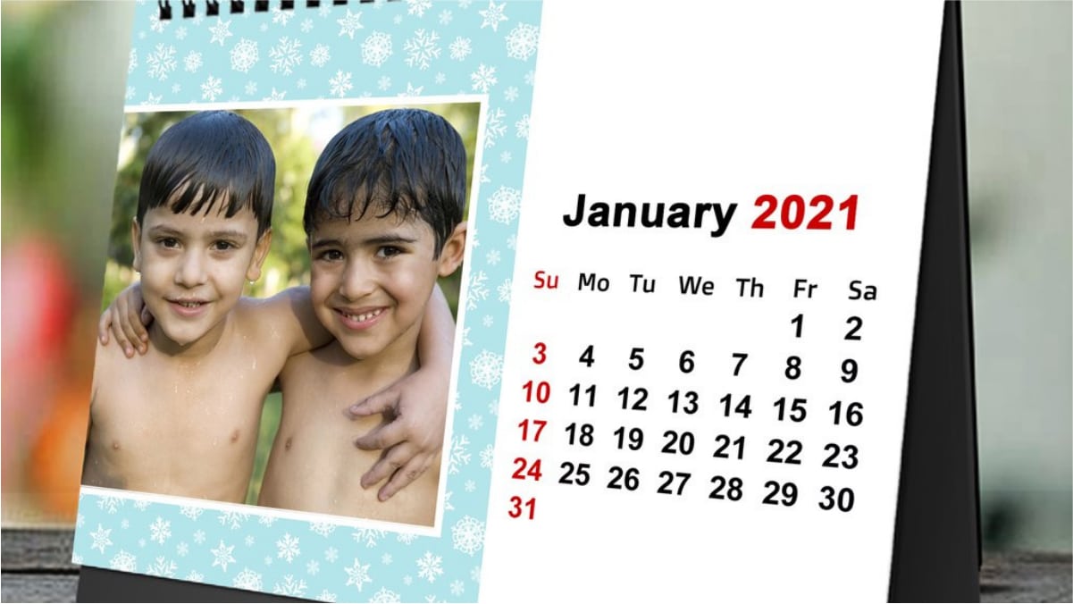 A calendar of 2021 showing two kids smiling and side hugs each other
