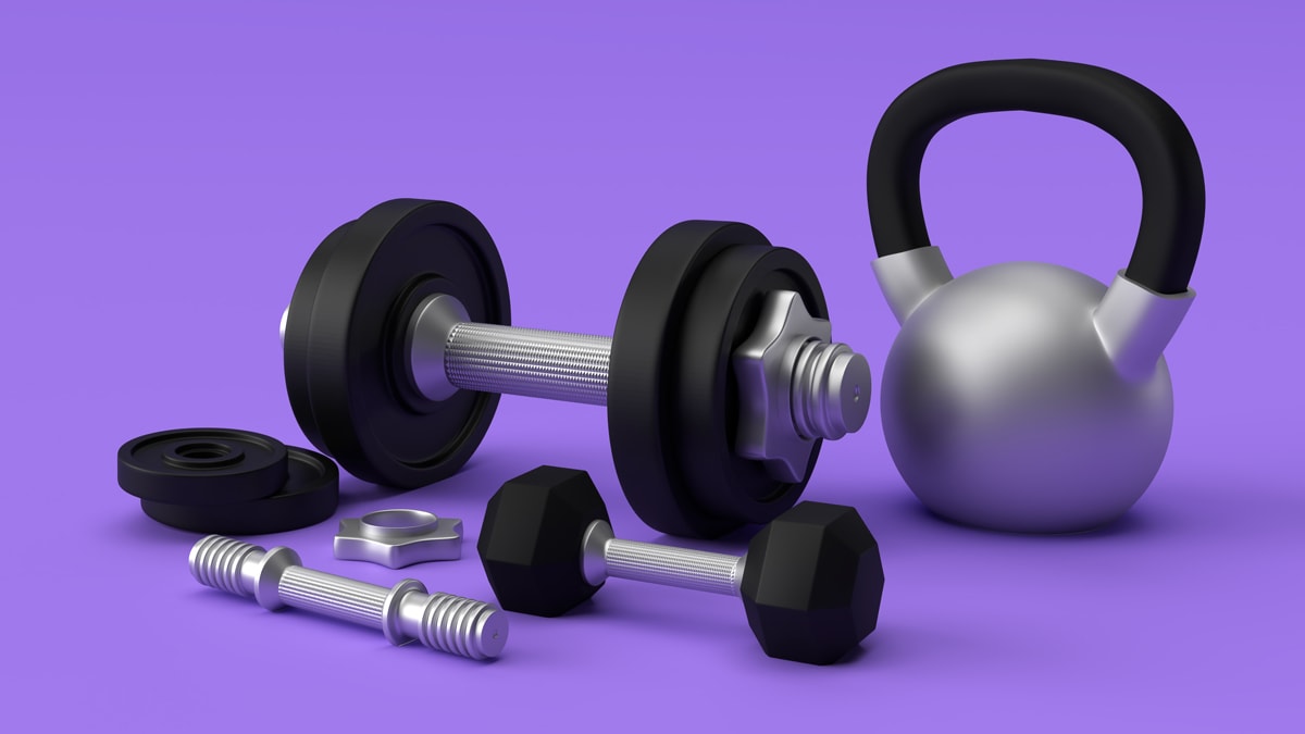 different types of dumbbell on a purple surface