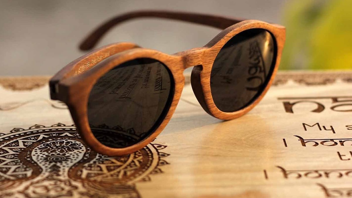 wood sunglasses on wooden surface