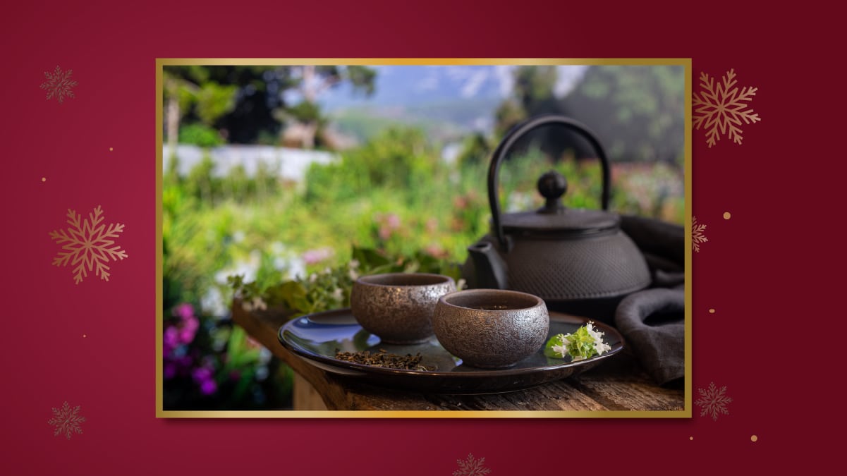 a teapot and some glasses on a table