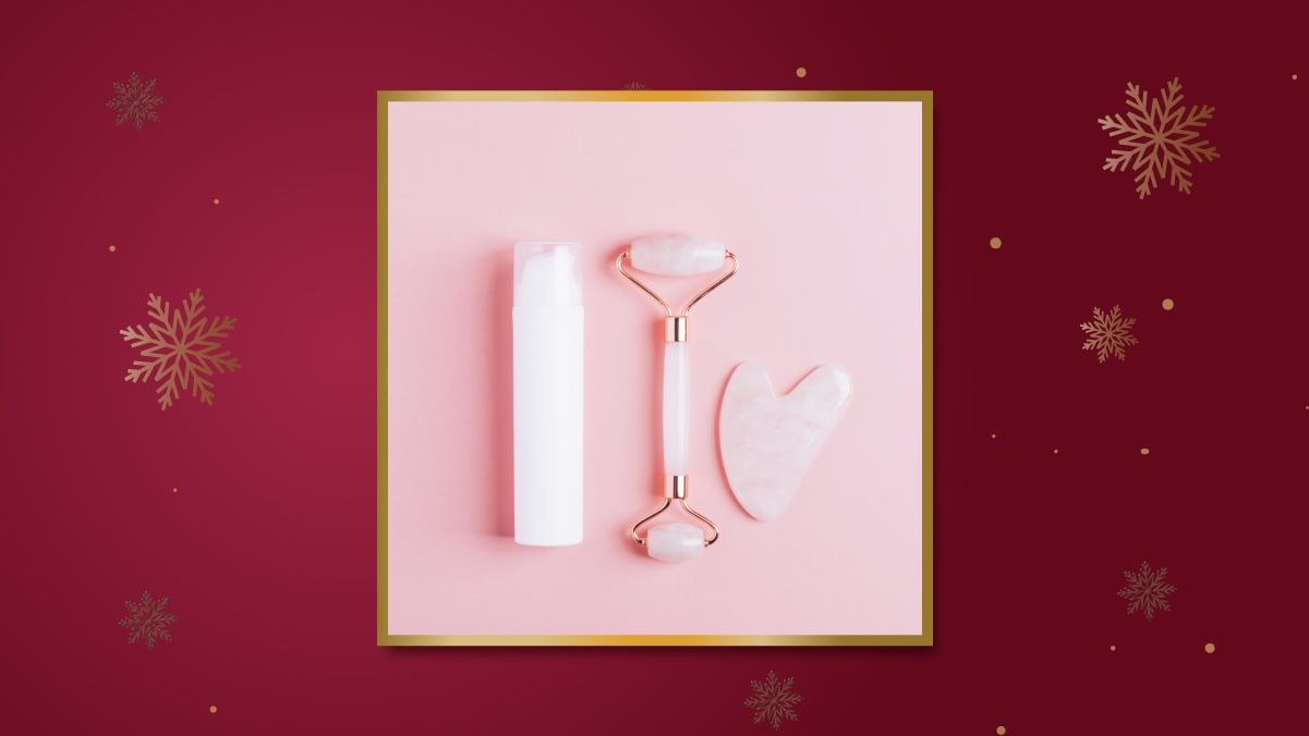 a facial massager on a pink surface, Christmas Gift For Her