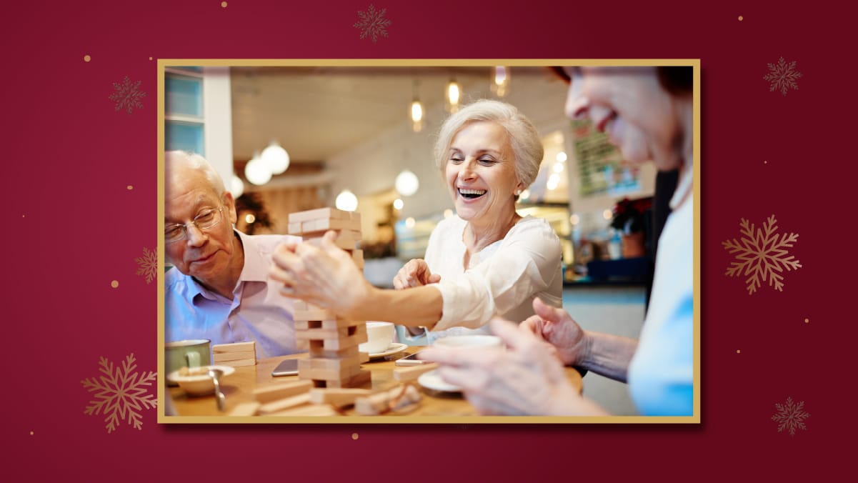 an elderly people playing Jenga