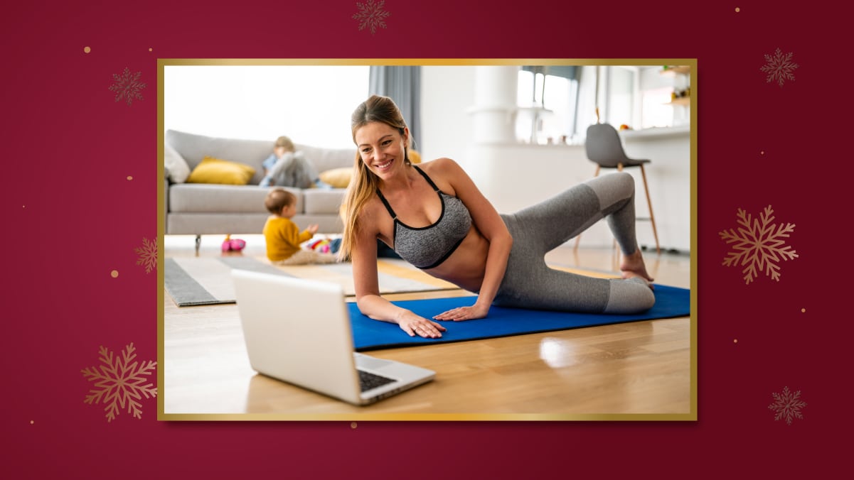 a girl is practicing yoga while attending a zoom yoga session