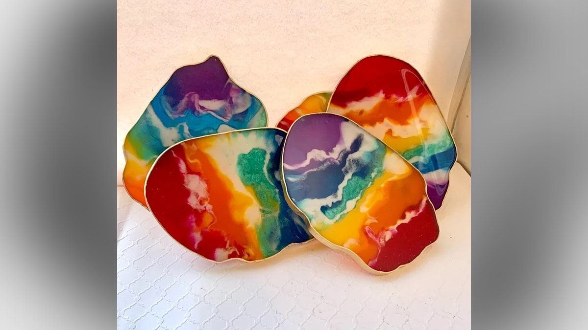 Rainbow coaster placed on a white table as a gifts for gay men.