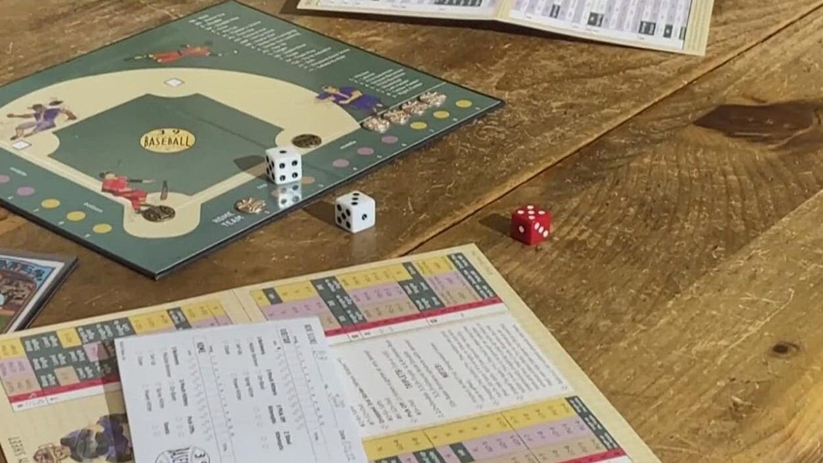 A baseball board game on a wooden table for your father in law