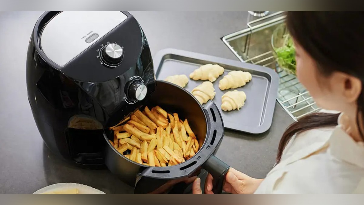 a girl using a air fryer to make some fries, a secret santa gift