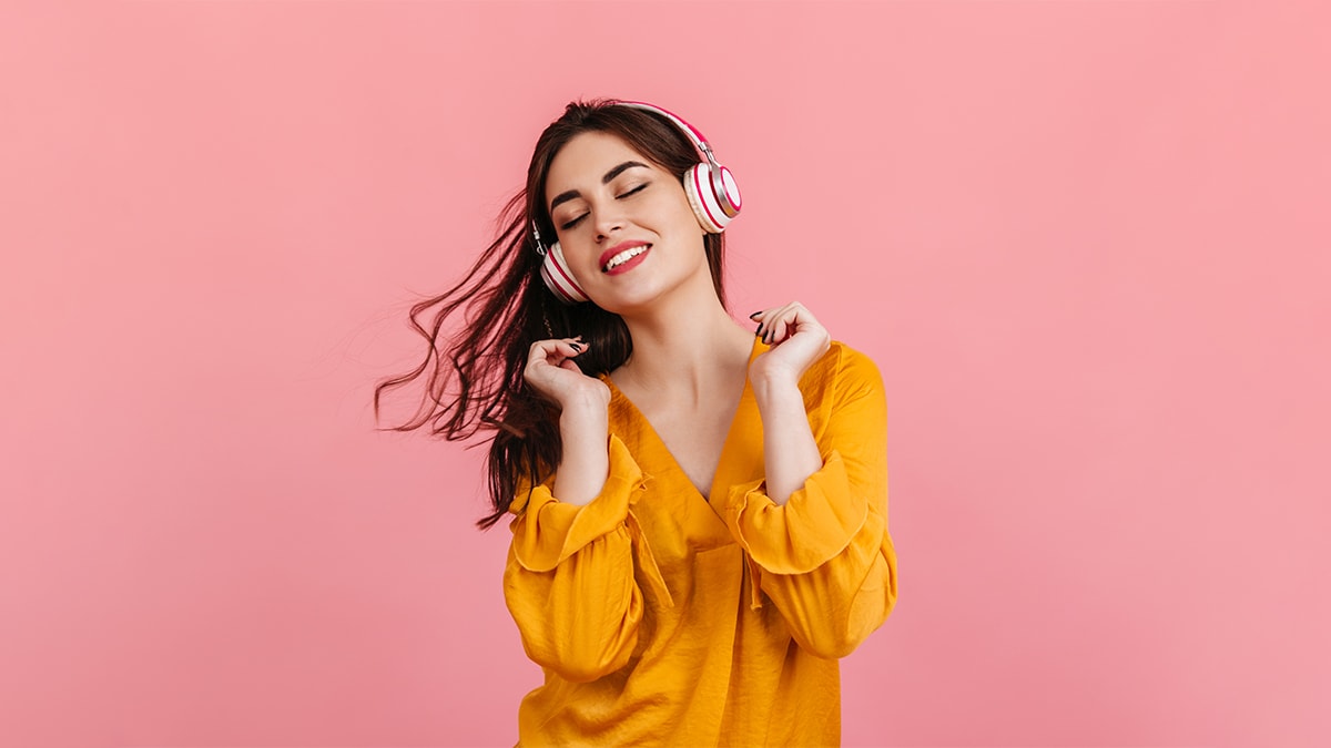 a girl enjoying music on her headphones, a secret santa gift