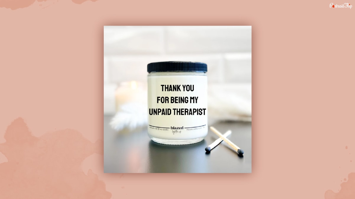 A candle with a label "thank you for being my unpaid therapist."